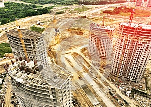 Ð¡onstruction site with tower cranes on building construction.