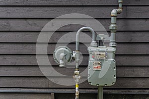 Domestic gas meter on a wall outside a house