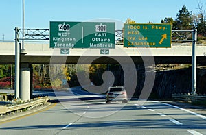 Ontario, Canada - October 28, 2019 - The view of the traffic on the Route 401 highway with exit towards Thousands Islands Parkway