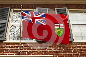 Ontario flag hanging on building .