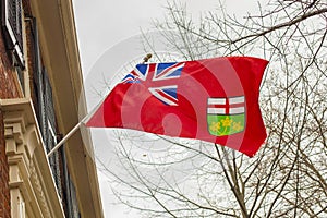 Ontario flag hanging on building .