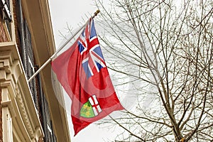 Ontario flag hanging on building .