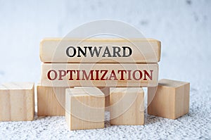 Onward optimization text on wooden blocks. Operational excellence concept photo