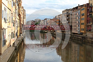 Onyar River crossing Girona with its typical colored houses photo