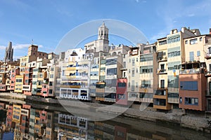 Onyar River crossing Girona with its typical colored houses photo