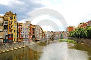 Onyar River in Girona, Spain, and colorful houses of the Old Tow