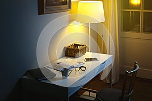 OObjects on the desk - Cup of hot drink, spectacles, books and tablet PC