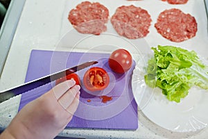 Ð¡ooking burgers in the kitchen at home.