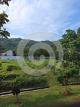 ool village under the foot of the mountain full of trees