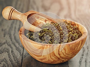 Oolong green tea in wood bowl