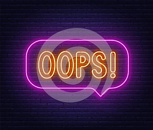 Oops neon sign in the speech bubble on brick wall background.