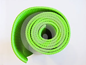 Op view green  yoga mat sport isolated.Rolled up yoga mat isolated on white. Copyspace.