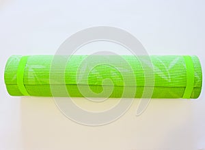 Op view green  yoga mat sport isolated.Rolled up yoga mat isolated on white. Copyspace.