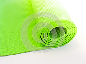 Op view green  yoga mat sport isolated.Rolled up yoga mat isolated on white. Copyspace.