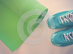 Op view green  yoga mat sport .Rolled up yoga mat isolated on white. Copyspace.