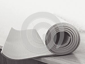 Op view green  yoga mat sport .Rolled up yoga mat isolated on white. Copyspace.