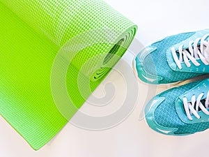 Op view green  yoga mat sport .Rolled up yoga mat isolated on white. Copyspace.