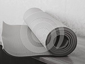 Op view green  yoga mat sport .Rolled up yoga mat isolated on white. Copyspace.