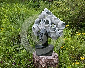 Opal stone sculpture titled Windy Day by David White in the Fort Worth Botanic Garden.