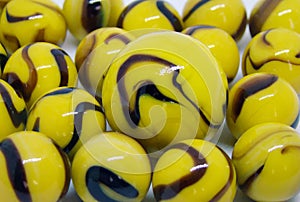 Opaque yellow and brown glass marbles