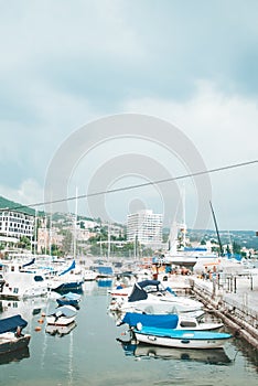 Opatija, Croatia - June 4, 2019: view of city harbor with boats ships and yachts