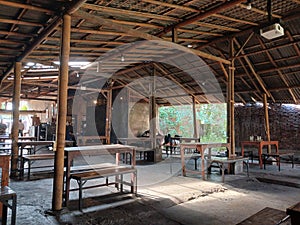 Open air cafÃ© with a rustic design.