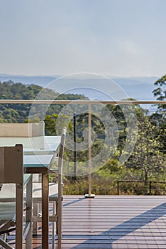 Open air dining area with chairs and table