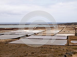 Open air drying salts in the open air along the coast of the island