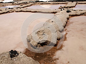 Open air drying salts in the open air along the coast of the island