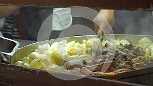 Open air Mexican taqueria Street food Restaurant Where two Mexicans are making tacos and quesadillas