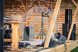 An open-air music stage with instruments and equipment.