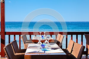 The open air restaurant by the sea is ready to receive visitors.