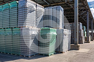The open air storage and carriage of the finished product at industrial facility. A glass clear bottles for alcoholic or soft
