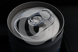 Open aluminum can with water drops