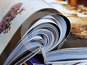 Open the annual report book on the table in the library