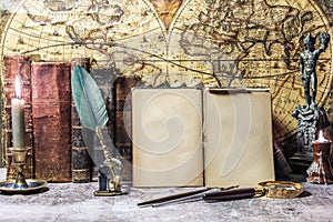 Open antique book on which a magnifying glass rests. are found on a wooden desk on leather. Two lighted lanterns are incorporated