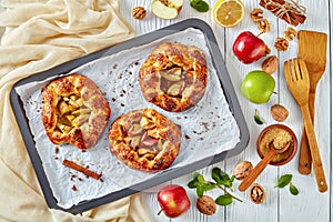 Open apple pies, galettes with apple slices