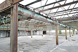 an open area with rusted steel beams and metal beams