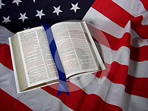 open Bible on American flag