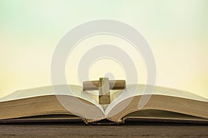 Open bible book on wood table