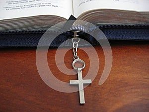 Open bible with cross