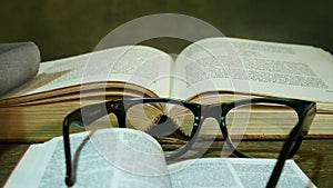 Open Bible with Glasses