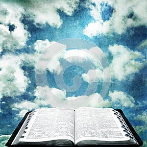 Open Bible with Grunge Sky