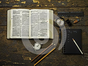 Open bible over a wood table