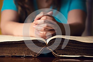 Open Bible With Praying Girl