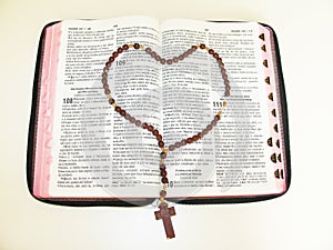 Open Bible with rosary crucifix religion Sao Paulo Brazil photo