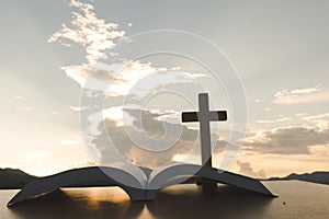 Open Bible, script in blur with focus on palm cross,on sunrise background, Crucifix, Symbol of Faith