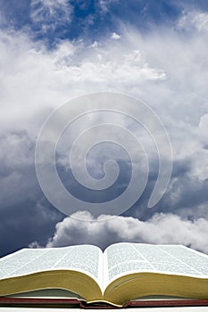 Open Bible with Sky