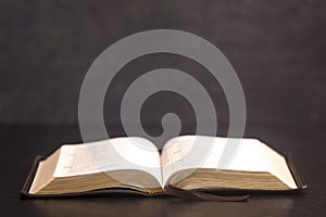 Open Bible on a Slate Tabletop