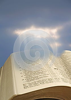 Open bible spiritual light rays
